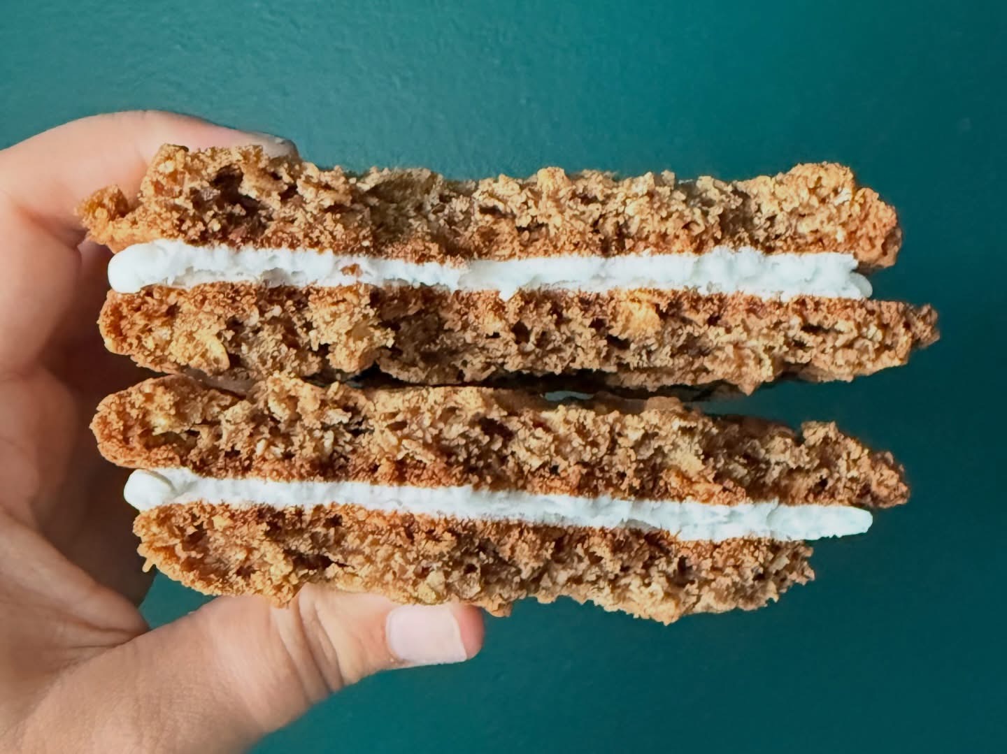 Cross-section of an oatmeal cream pie showing the cream filling