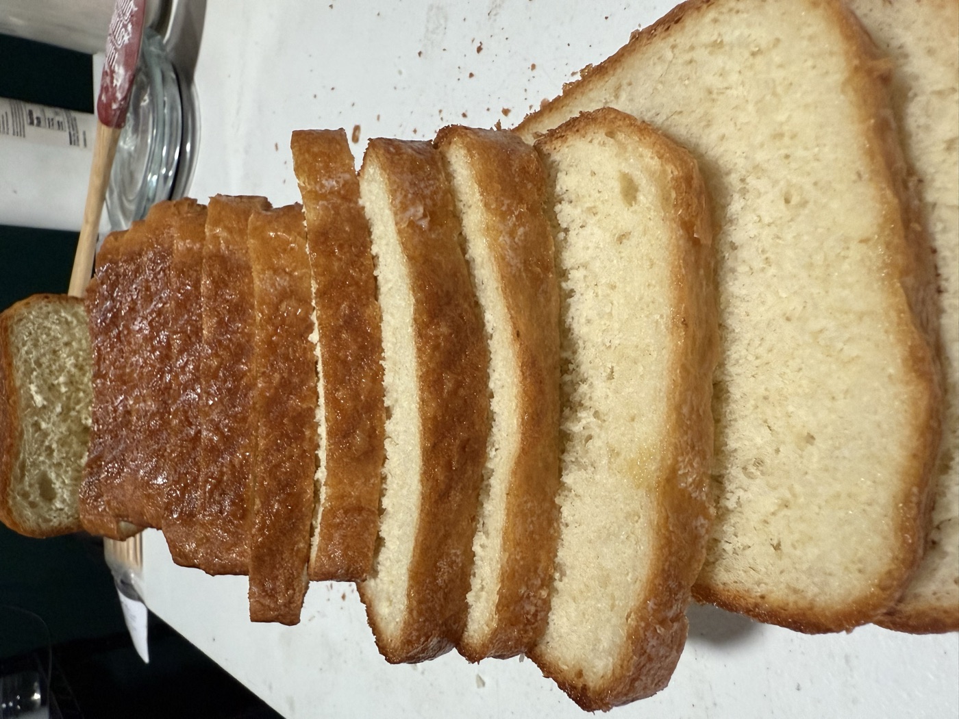 Loaf of soft white sandwich bread cut into thick slices